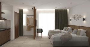 a living room with a white couch and a kitchen at Azulic Suites Nikiti in Nikiti