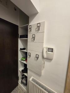 a walk in closet with a tv on the wall at Ski & SunDeck in Bjelašnica