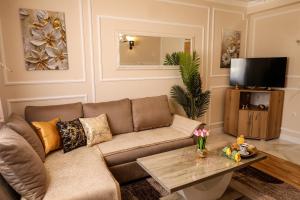 a living room with a couch and a table at Apartman Boki in Bileća