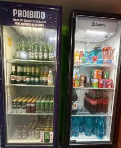 a refrigerator filled with lots of drinks and soda at ECO PARADISE -Apt 212 in Caucaia