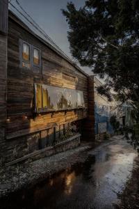 a building with a window on the side of it at Bear house Dalat in Da Thien