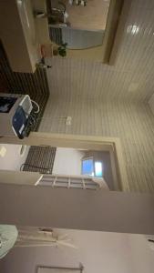 an overhead view of a prison cell with a room at شاليه in Al Bukayriyah