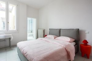 Posteľ alebo postele v izbe v ubytovaní Saragozza Apartments