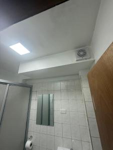 a bathroom with a shower and a mirror at Hotel boutique Blanca Gazza in Arica