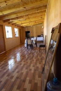 a large room with a table and chairs in it at Hostal Urenda in Los Ángeles