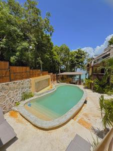 a swimming pool in the middle of a yard at Villas Mandarina Bacalar in Bacalar