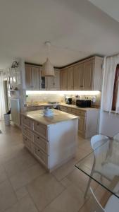 a kitchen with an island in the middle of it at Ciliano 16 in Montepulciano +26 photos