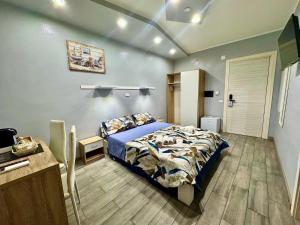 a bedroom with a bed and a desk in it at The Queen Tropea in Tropea +51 photos