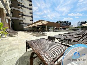 a group of benches and tables in front of a building at Spazzio diRoma in Caldas Novas +54 photos