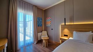 a hotel room with a bed and a window at Hotel Bankir Khiva in Khiva +111 photos