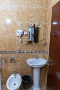 a bathroom with a sink and a toilet at Kasneci Apartments in Ulcinj +46 photos