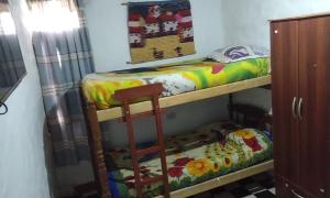 a room with two bunk beds and a ladder at maimareña in Maimará