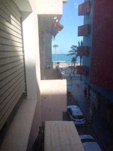 a view of the beach from the balcony of a building at Casa chispa in Águilas
