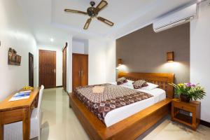 Cama o camas de una habitación en Sandat Bali Ubud