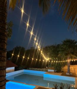 a swimming pool at night with lights at Hotel Mare in Santa Maria Huatulco +12 photos