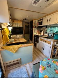 an interior view of a kitchen in an rv at SpongeBob SquarePants on the River in Bullhead City +14 photos