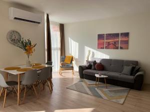 a living room with a couch and a table at Barceló Apartment Velingrad in Velingrad