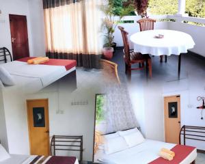 a room with a bed and a table and chairs at Chandi Mahal HomeStay in Kandy