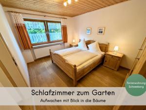 a small bedroom with a bed and a window at Gästehaus Philipp im Herzen des Fichtelgebirges - 5 Ferienwohnungen, großes Grundstück, Wald und Wiese, Wohnung mit privater Sauna, kostenfreie Parkplätze, WLAN in Mehlmeisel