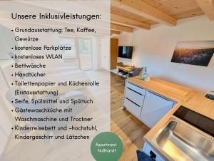 a kitchen with ailingual wall with descriptions of a kitchen at Gästehaus Philipp im Herzen des Fichtelgebirges - 5 Ferienwohnungen, großes Grundstück, Wald und Wiese, Wohnung mit privater Sauna, kostenfreie Parkplätze, WLAN in Mehlmeisel