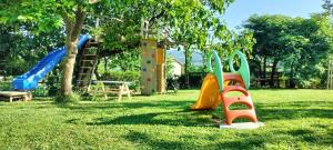 a park with a playground with a slide at Ka6 Infinity Apartment - Vipava Valley in Ajdovščina
