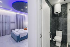 a bathroom with a toilet and a sink at APART-HOTEL PRESiDENT 2 in Ulcinj +61 photos