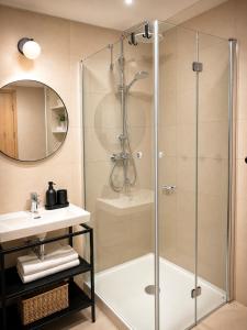 a bathroom with a shower and a sink at Apartmán Hubertus No. 17 in Karlova Studánka +29 photos