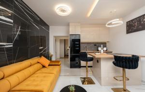 a living room with a couch and a kitchen at Top View Biograd in Biograd na Moru