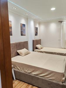a bedroom with two beds in a room at LuXURY STUDIOS MATROUH 3 in Marsa Matruh