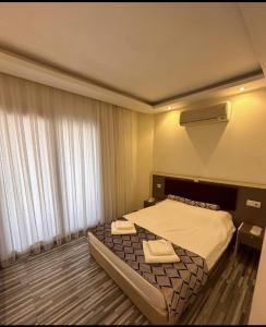 Krevet ili kreveti u jedinici u okviru objekta Hotel Falcon Home +10 fotografija