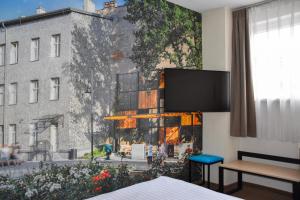 a hotel room with a view of a building at Iness Hotel in Łódź