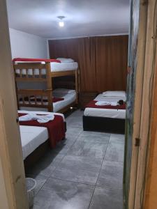 a room with three bunk beds in it at Alojamiento donde Nur in Filandia +15 photos