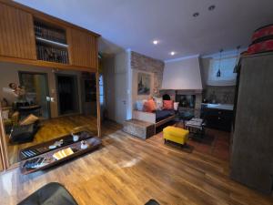a living room with a couch and a table at Homeric poems Suites in Chios