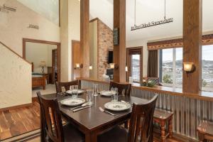 a dining room with a table and chairs at Mountainside Unit B-8 in Granby +22 photos