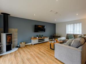 a living room with a couch and a fireplace at 2 Bed in Weymouth oc-75201 in Weymouth