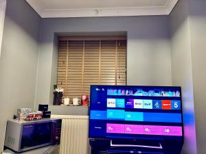 a flat screen tv sitting in a living room at 40 kennett gardens in Gloucester