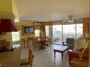 a living room with a couch and a table at Beachfront Condo in Simpson Bay, SXM - 2BR 2BA in Simpson Bay