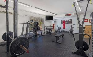 a gym with lots of equipment in a room at Beachfront Condo in Simpson Bay, SXM - 2BR 2BA in Simpson Bay