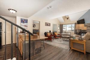 a large living room with a kitchen and a living room at Summit Unit 1303 in Granby