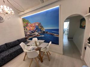 a dining room with a view of the ocean at LE CINQUE VELE ***** Cinque Terre in Monterosso al Mare