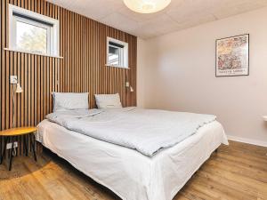 a bedroom with a large bed in a room at 6 person holiday home in Vinderup-By Traum in Vinderup