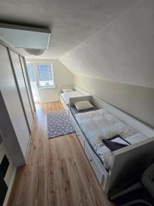 a small room with two beds in it at Dom pri jazere Nitrianske Rudno in Kostolná Ves +24 photos