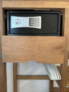 a microwave oven sitting on top of a wooden shelf at Donde Andres en la Playa in Necoclí