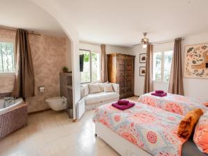a bedroom with two beds and a bathroom at Belle vue in Flayosc +22 photos