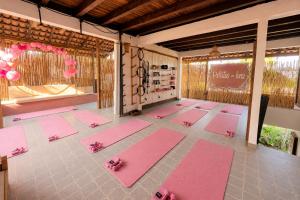 a room with pink yoga mats on the floor at Hotel Verdemar in Acapulco