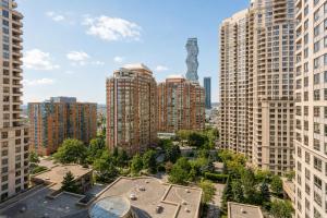 an aerial view of a city with tall buildings at High-End 2BR 2BATH Condo-Steps to Square One Mall in Mississauga