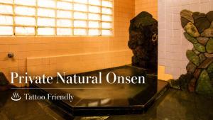 a bathroom with a statue of a head on the wall at Yoshiharu in Toyooka +98 photos