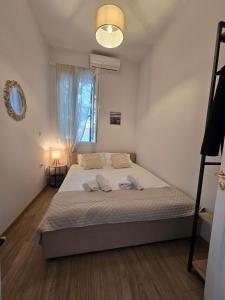 a bedroom with a large bed in a room at Stone House with Panoramic Views in Marmaro in Mármaron