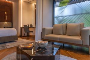 a living room with a couch and a table at Noah's Hideaway by Tifakara in Fortuna +18 photos