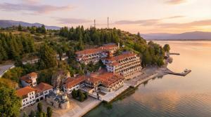 an aerial view of a building on an island in the water at Hotel Biser in Kališta